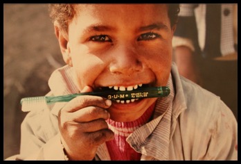 Photo of kid with toothbrush